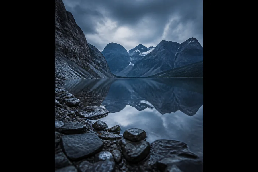 Alpine canyon reflected in a still lake